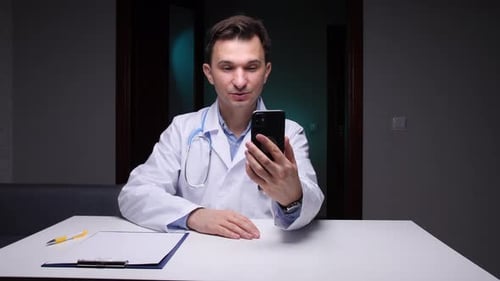 Young Doctor Telemedicine Consultation Online with Mobile Phone