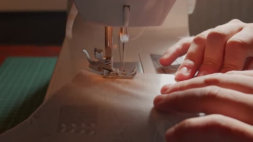 Pushing fabric through a sewing at close proximity