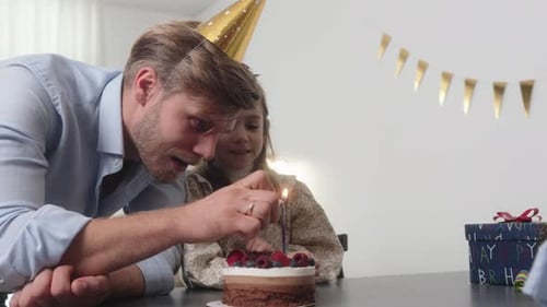 Father and Daughter Celebrate Birthday with Cake