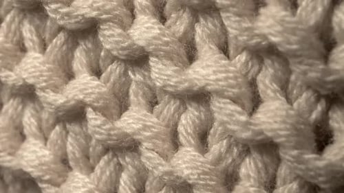 Macro of Cream-colored, Intricate Knitted Wool Pattern