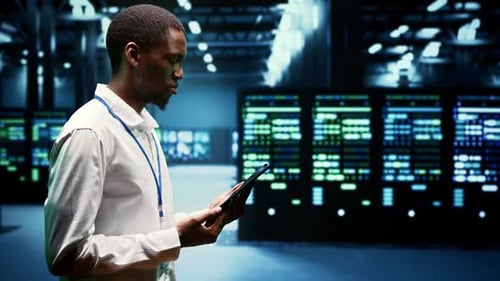 Data Technician with Tablet in Server Room