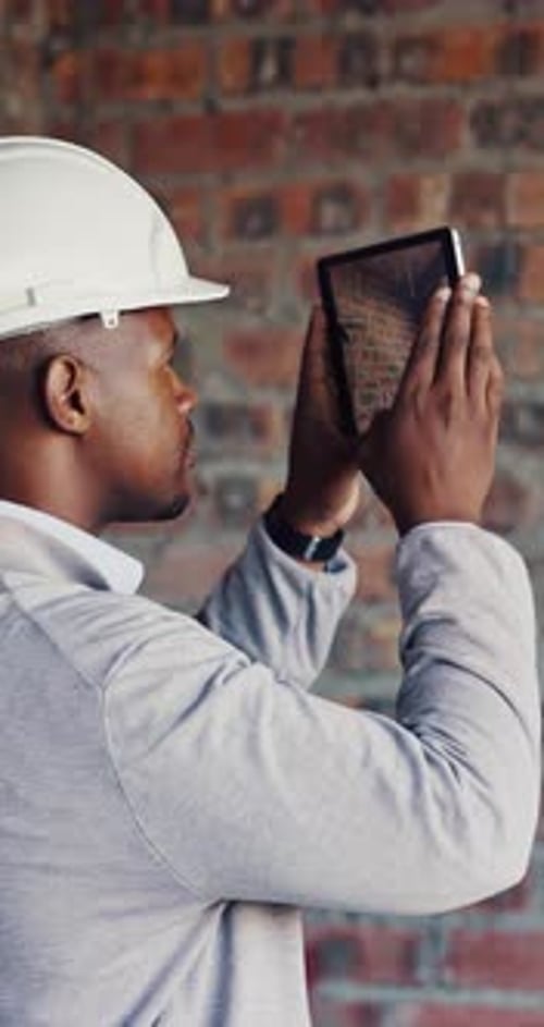 Construction, man or picture of brick wall on tablet screen for wiring, inspection or safety record