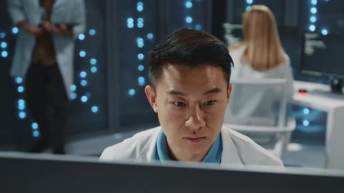 Focused Scientist Analyzing Data in Modern Server Room