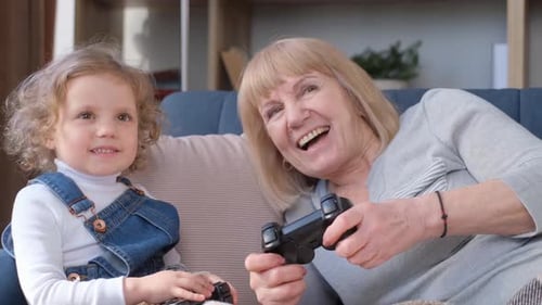 Grandmother and Grandchild Play Video Games Together