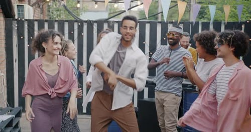 Friends Dancing at an Outdoor Party