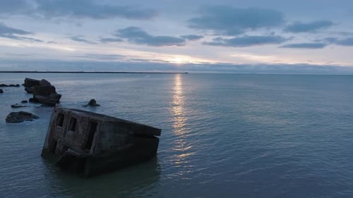 Beautiful aerial establishing view of Karosta (Liepaja) concrete coast fortification ruins, vibrant