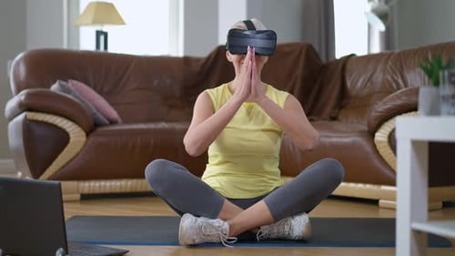 Senior Woman Wearing VR Headset Meditating at Home