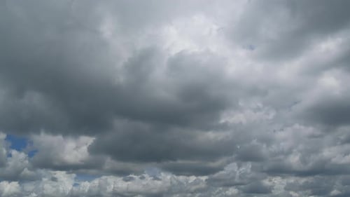 Clouds Moving Slowly Across a Blue Sky