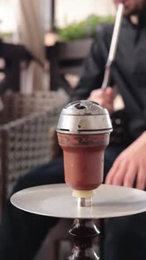 preparing a hookah at the bar