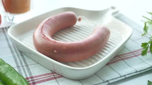 Raw Fresh Sausage and Vegetables on Table