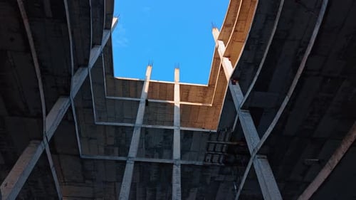 Inside the carcass of the high-rise building under construction. Low angle view.