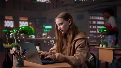 Young Adult Studying in the University Library to Obtain Her Diploma