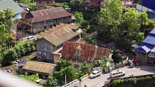 Aerial View of Village Buildings Surrounded by Nature