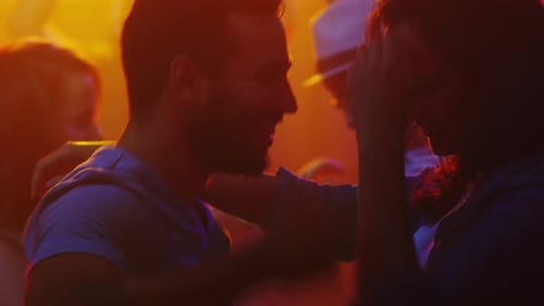 Happy Couple Dancing at a Night Club