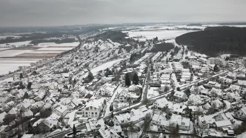 Pullback Drone Snowy Suburban Village Wide