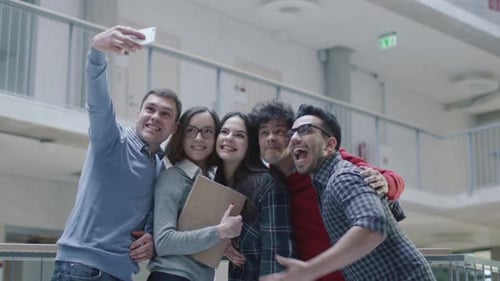 Group of young multi-ethnic students are making selfie photos in an university.