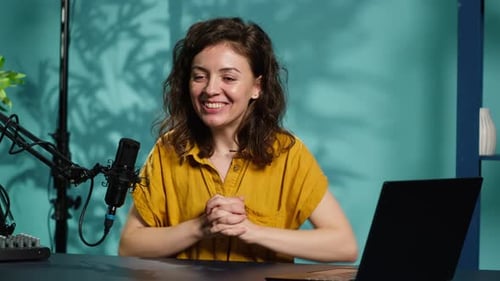 Woman Recording Podcast in Professional Studio Setting