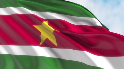Realistic Waving Suriname Flag Against Blue Sky