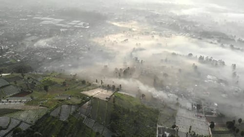 Aerial view of beautiful foggy mountain valley in the morning