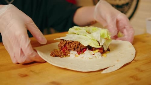 Close Up of Chef Cooking Burrito Eating Traditional Mexican Food Tex Mex Cuisine