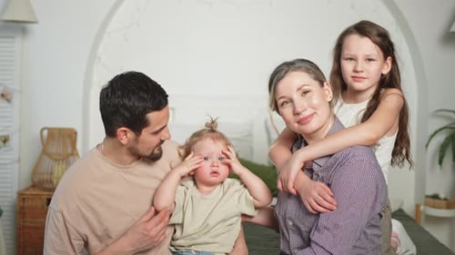 Happy Family Posing Together at Home
