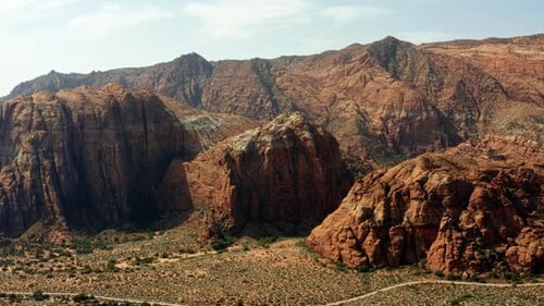 Beautiful aerial drone landscape nature left trucking shot of stunning red rock formations with drie