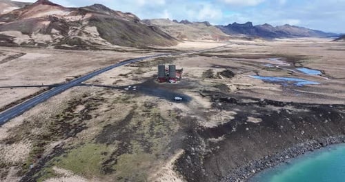 Abandoned Iceland farm, overtaken by nature, revealed through drone footage of decayed structures an