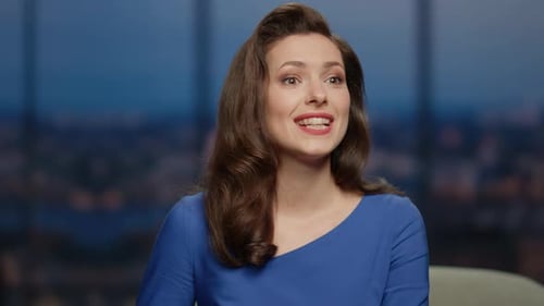 Smiling Woman Presenter Interacting with Talk Show Audience in Studio Close Up