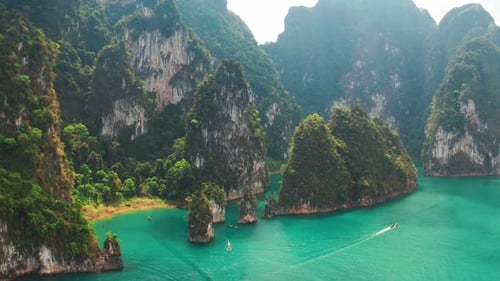 Three limestone rocks Three Brothers at Cheow Lan Lake, Khao Sok National Park, Surat Thani Province