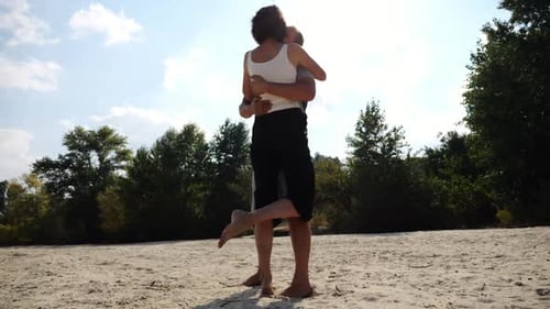 Happy Couple Spending Time at Sandy Beach Man Kissing His Beloved on Seashore at Sunny Day Carefree