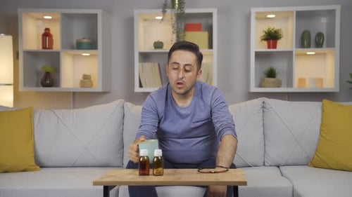 The sick man drinks a lot of water.