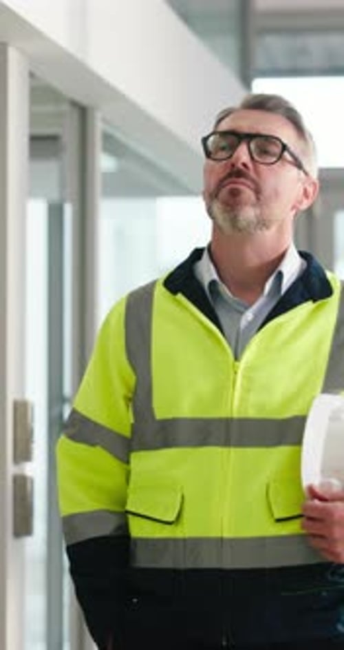 Walk, construction and man with building inspection to monitor safety, renovation project