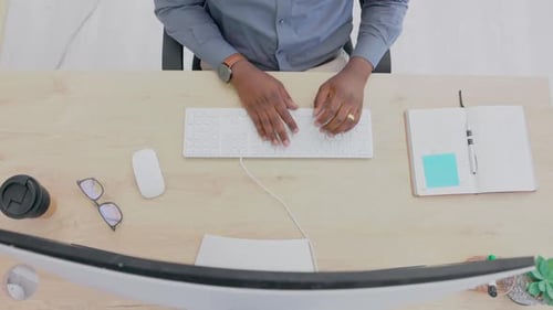 Top view of black man, hands and typing on computer in office for data planning