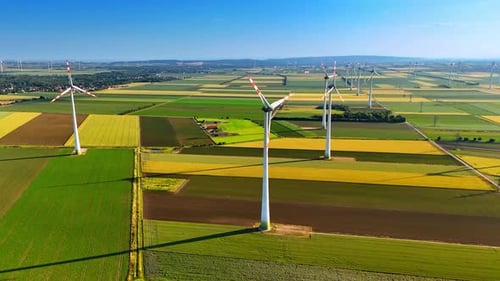 Wind rotates the blades of the wind turbines.