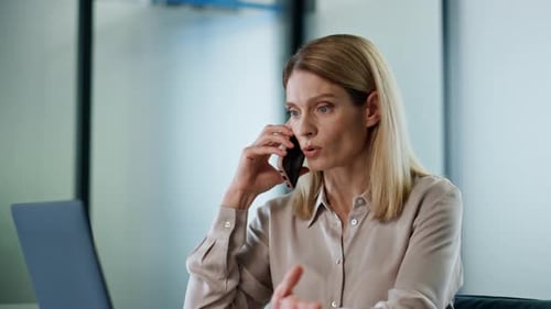 Calm Director Talking Smartphone At Office Close Up. Serious Businesswoman Having Business Conver...