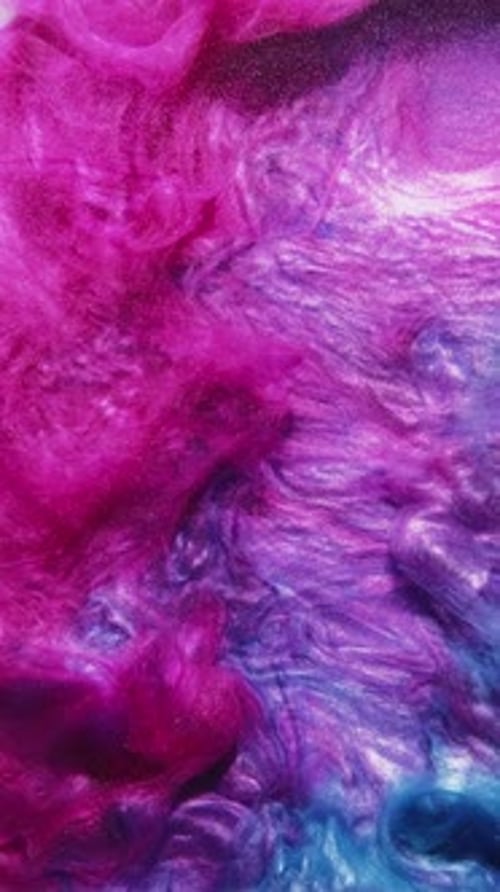 Swirling Pink and Blue Fluid Motion