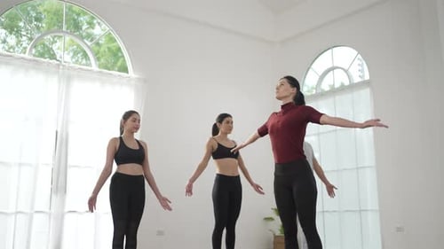Yoga Class in Bright Studio Stretching