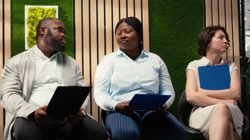Job Applicants Sitting in Waiting Room for Interview