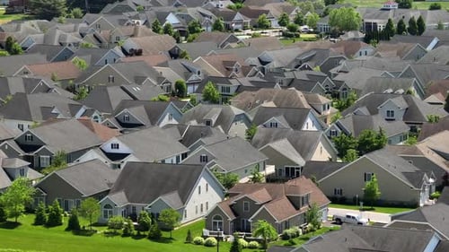 Modern dense suburb Townhouses in new developed neighborhood of America. Grey and brown roofs of hou