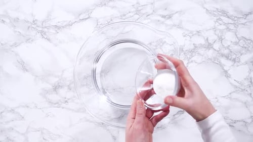 Mixing Water with Powder in Bowl