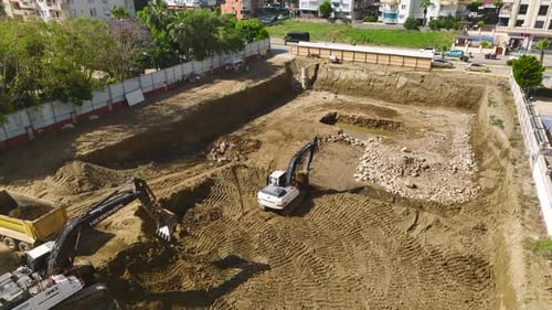 Aerial View of Construction Site with Heavy Machinery