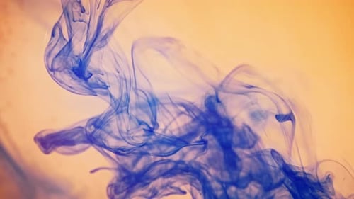 Blue Ink Swirling in Water Abstract