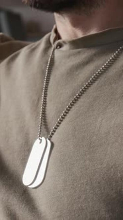 Vertical Close-up of Military Man with Beard Wearing Identification Tag