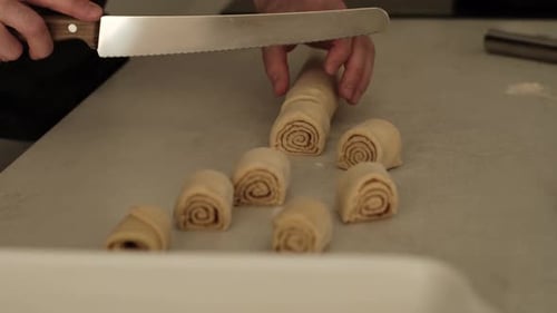 Preparing Cinnamon Rolls in Bright Kitchen