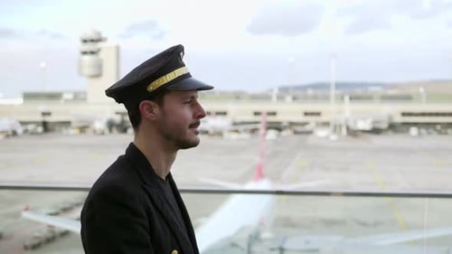 Confident Pilot Poses at Airport
