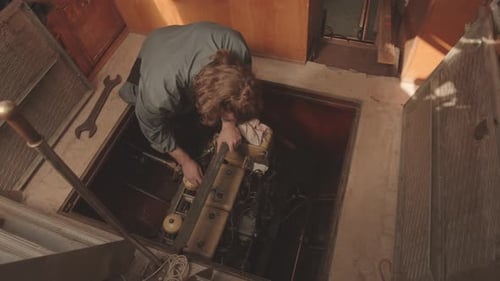 Marine Mechanic Repairing Yacht Engine