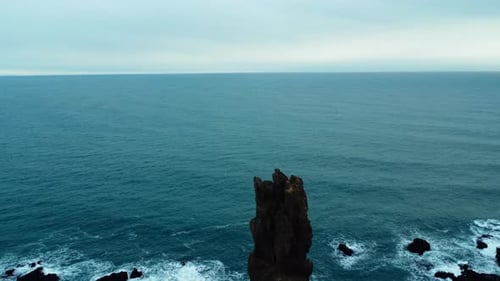 Waves Hitting Rock In Icelandic Sea