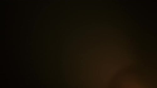The Frame Depicts an Abstract on a Black Background Isolated Fire Glare Moves in the Frame