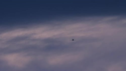 Airplane Descending Into Cloud Layer