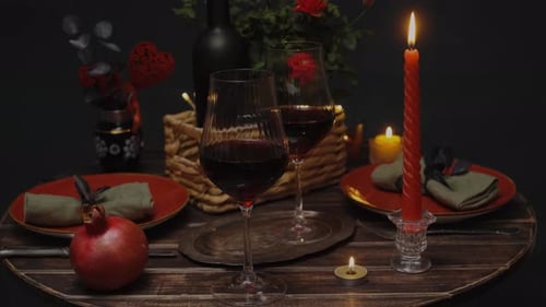 Romantic Candlelit Dinner Table with Red Wine